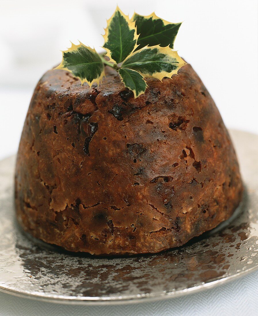Christmas pudding with sprig of holly