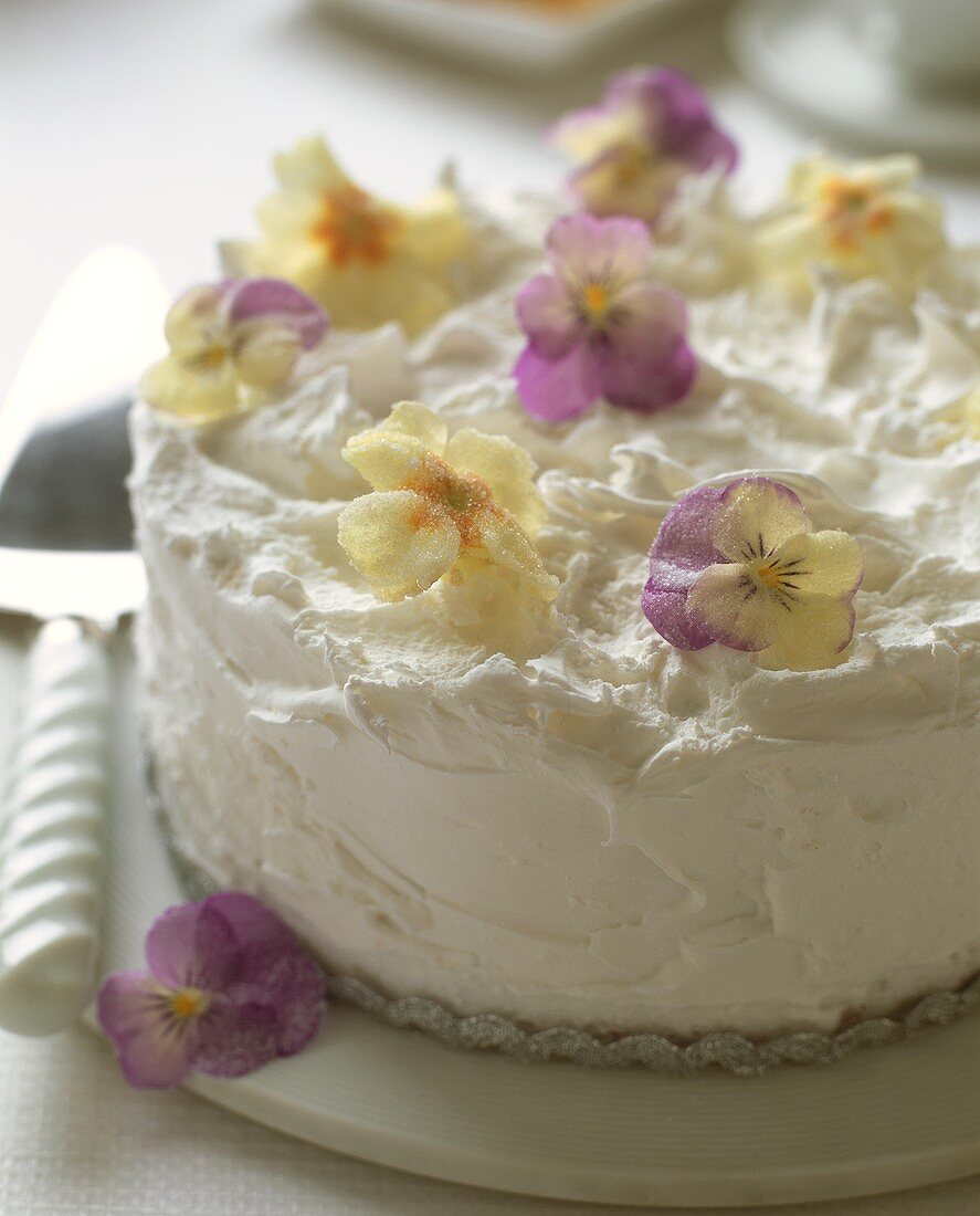 White cake with candied flowers