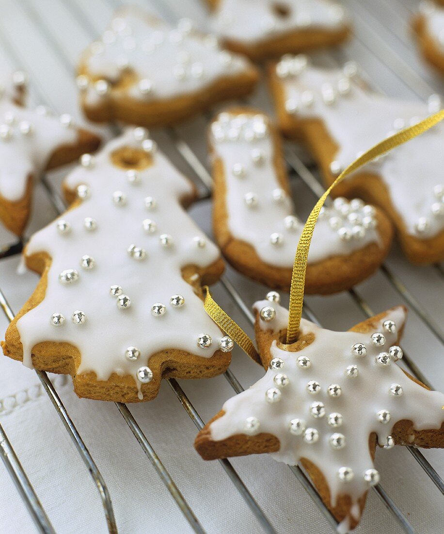 Glazed biscuits with silver balls as tree ornaments