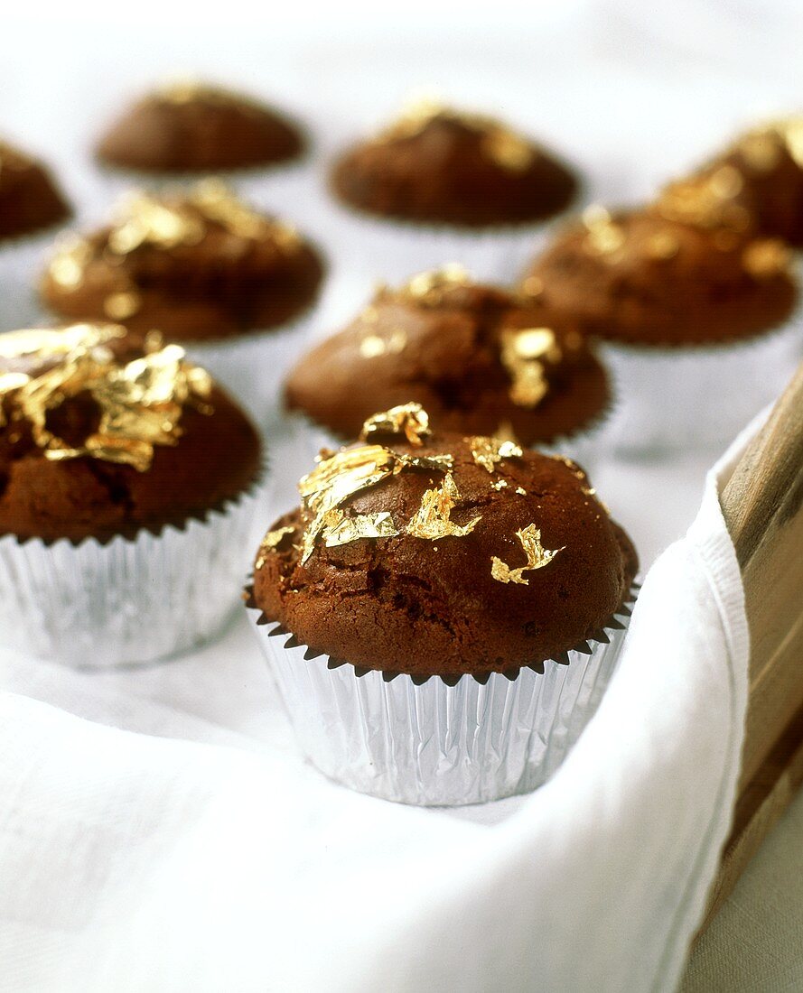 Chocolate muffins with gold foil