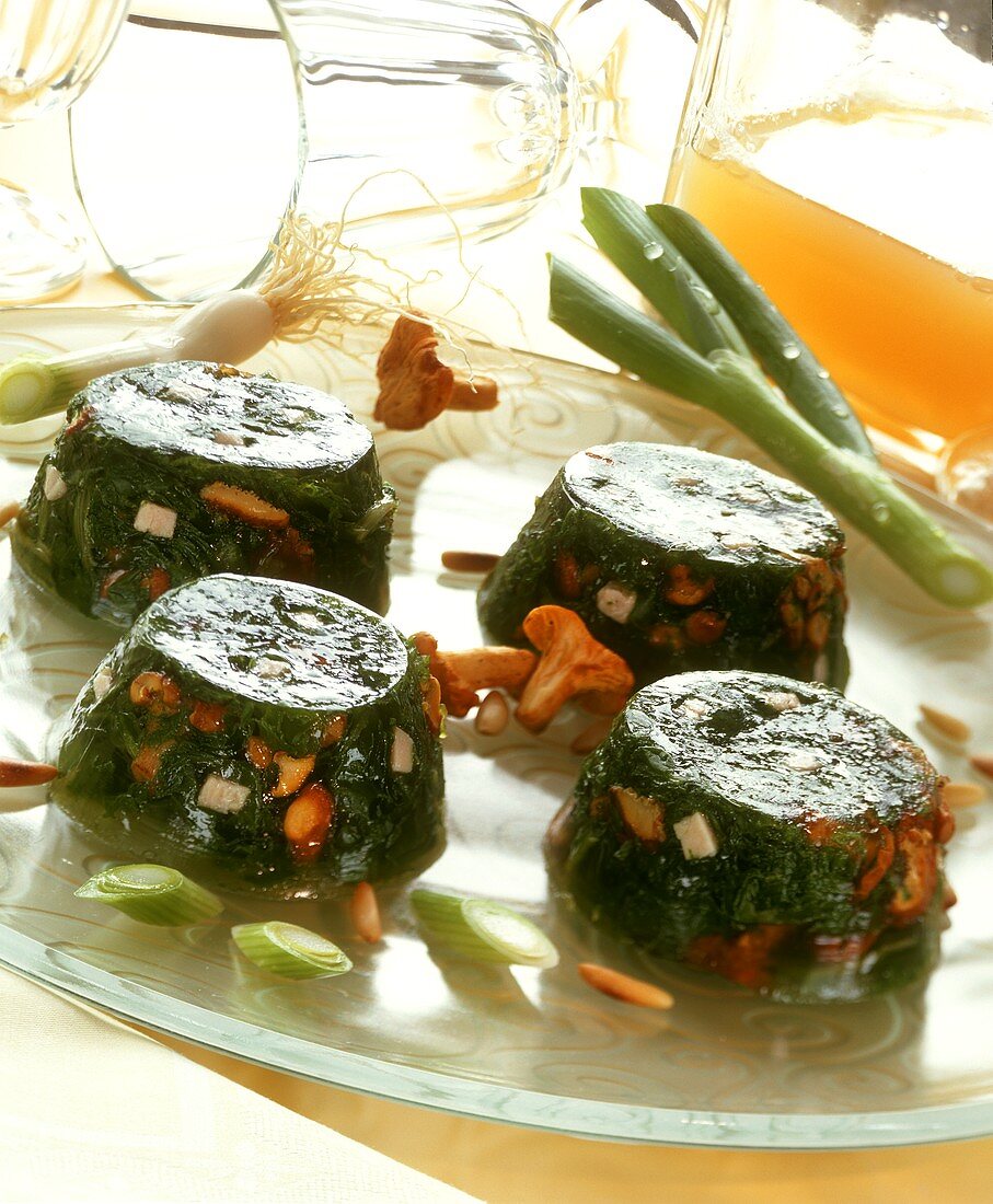Vegetables in aspic with ham and chanterelles