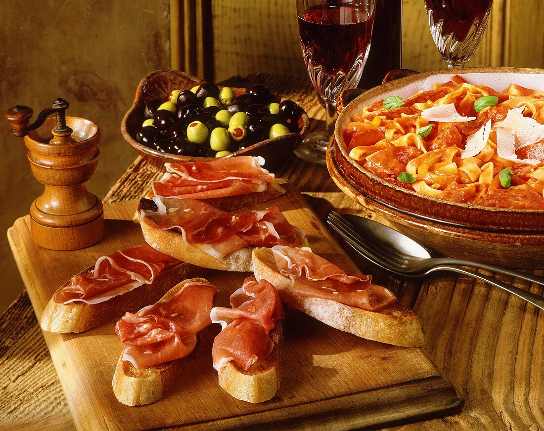Various Spanish appetisers on rustic table