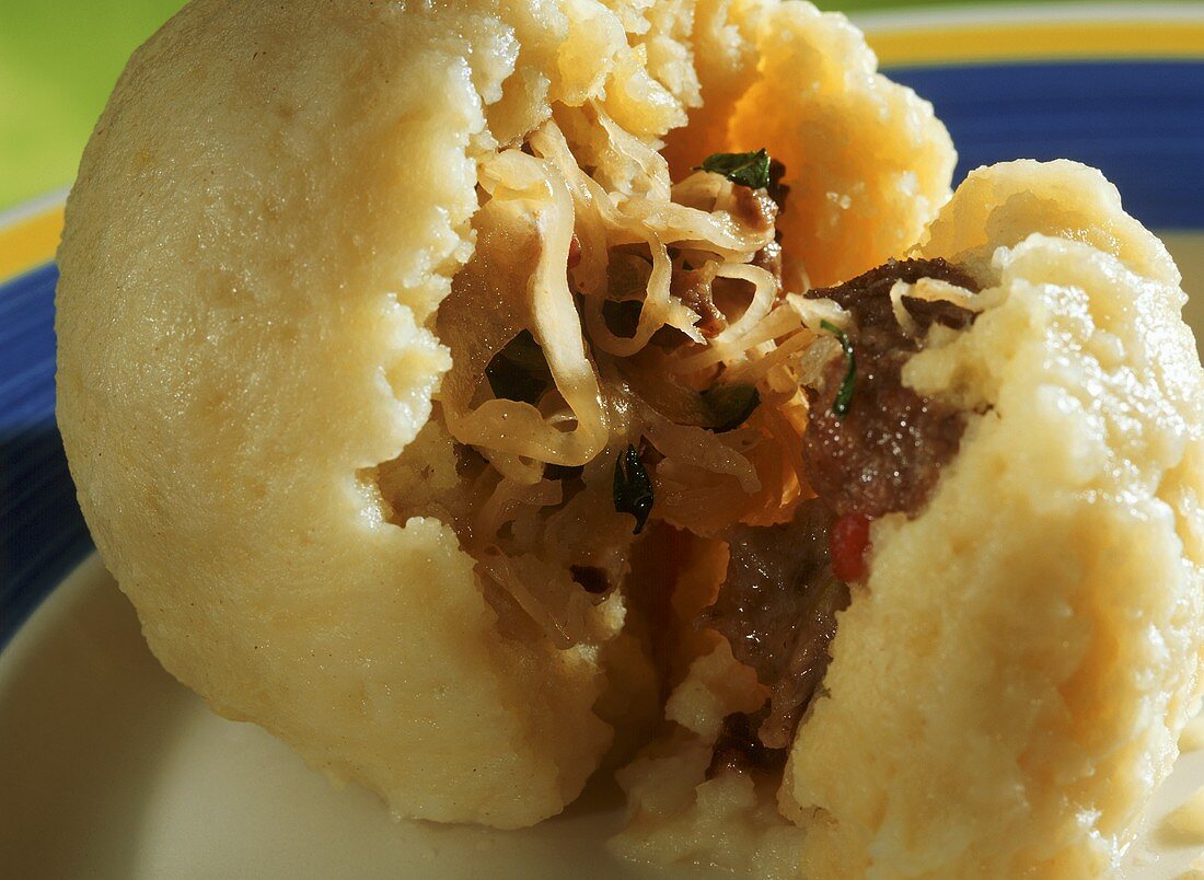 Potato dumplings with sauerkraut and mince filling