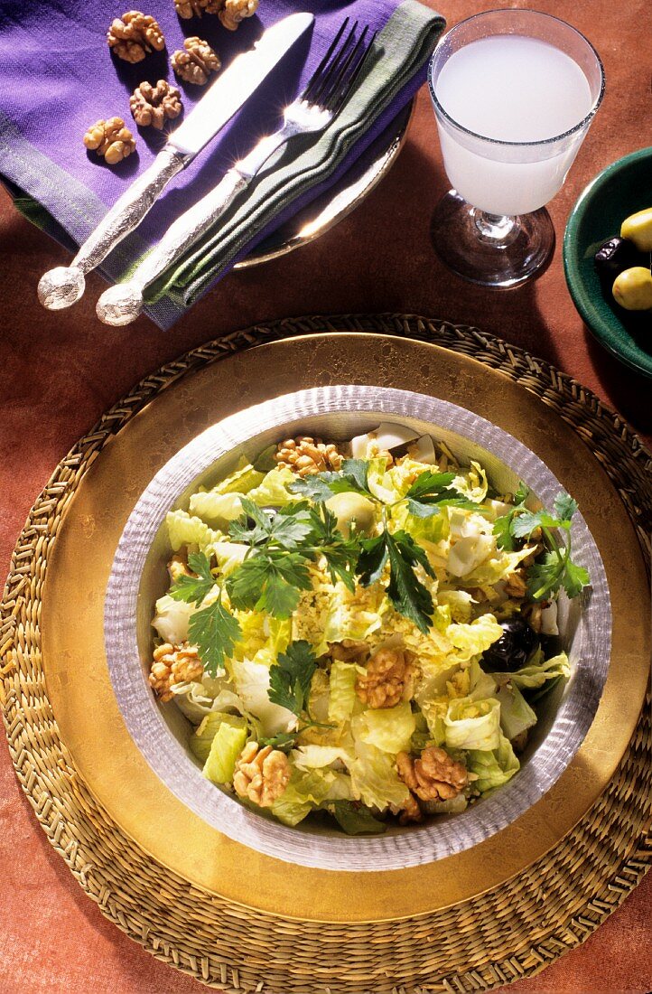 Green salad with olives and nuts