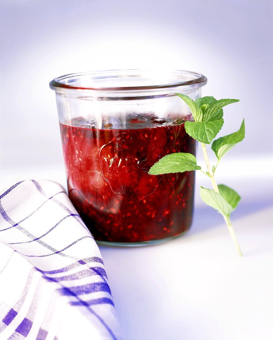 Raspberry and blueberry jam with mint