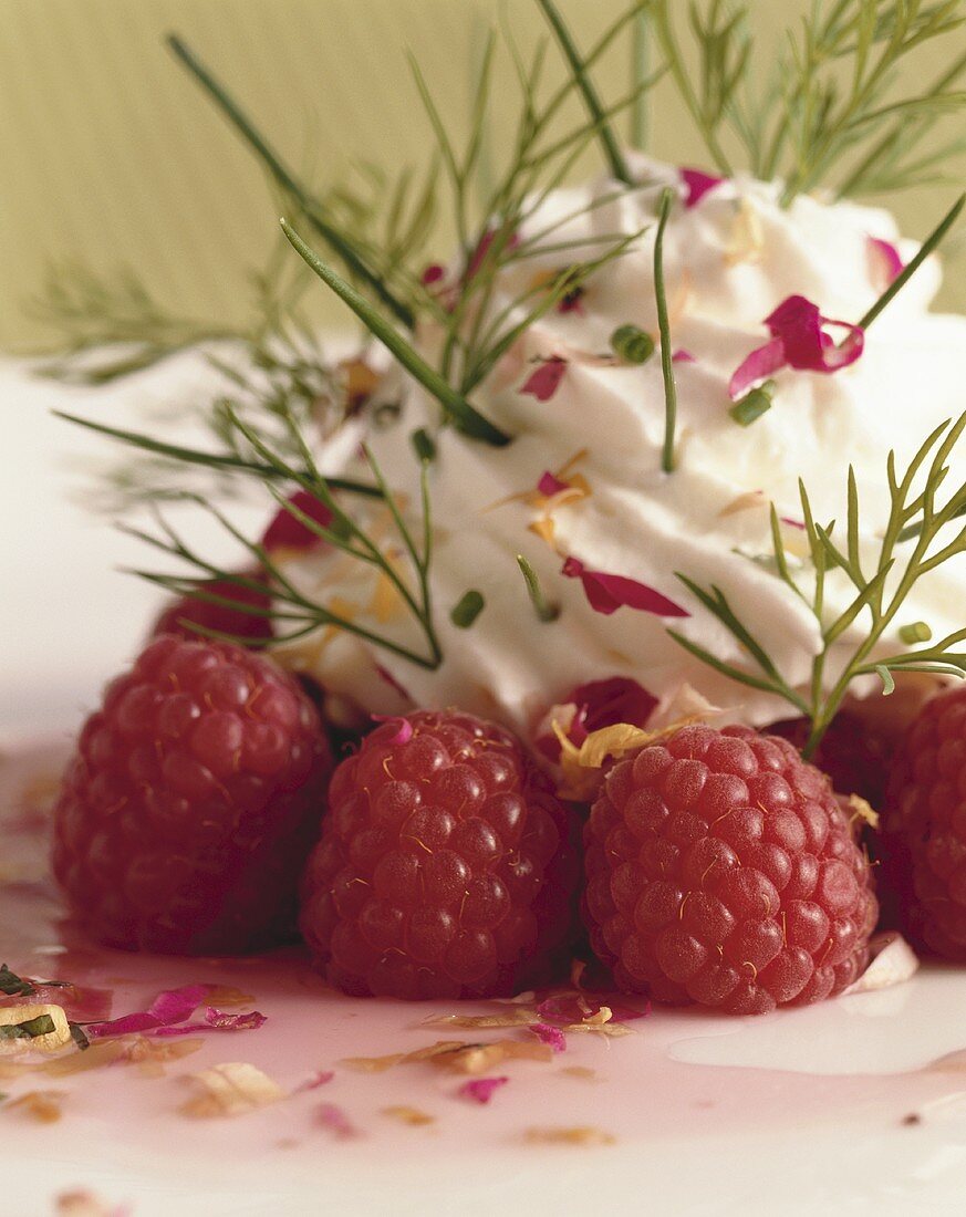 Raspberries with herb cream and rose petals