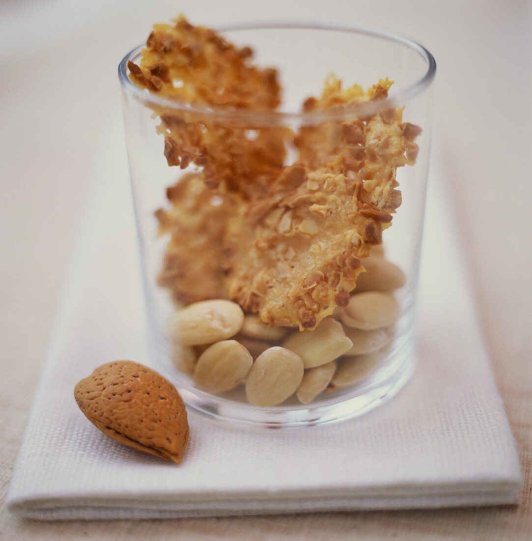 Almond pralines and almonds in a jar