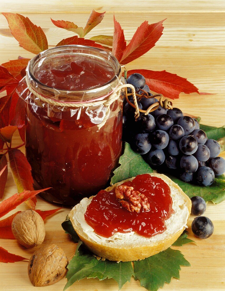 Grape jam in jar and on bread