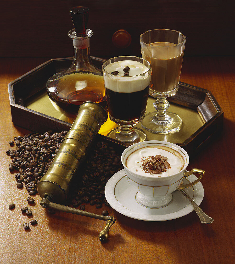 Still life with speciality coffees, coffee beans & whisky