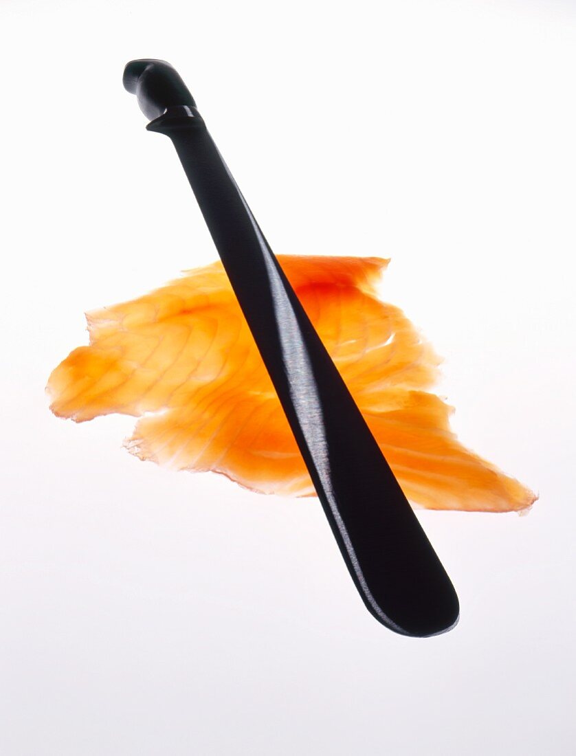 Salmon knife and slice of salmon