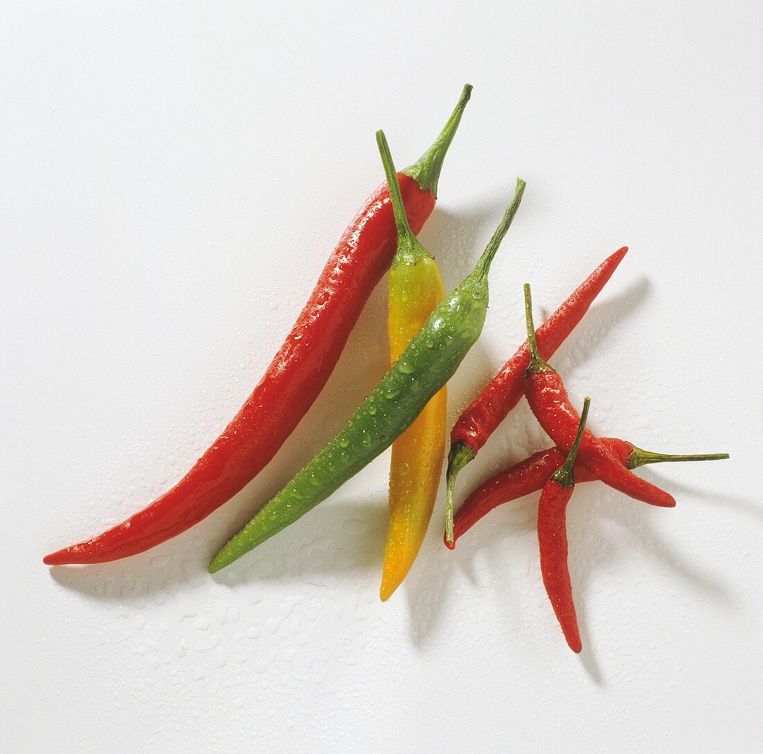 Red, green and greeny yellow chili peppers