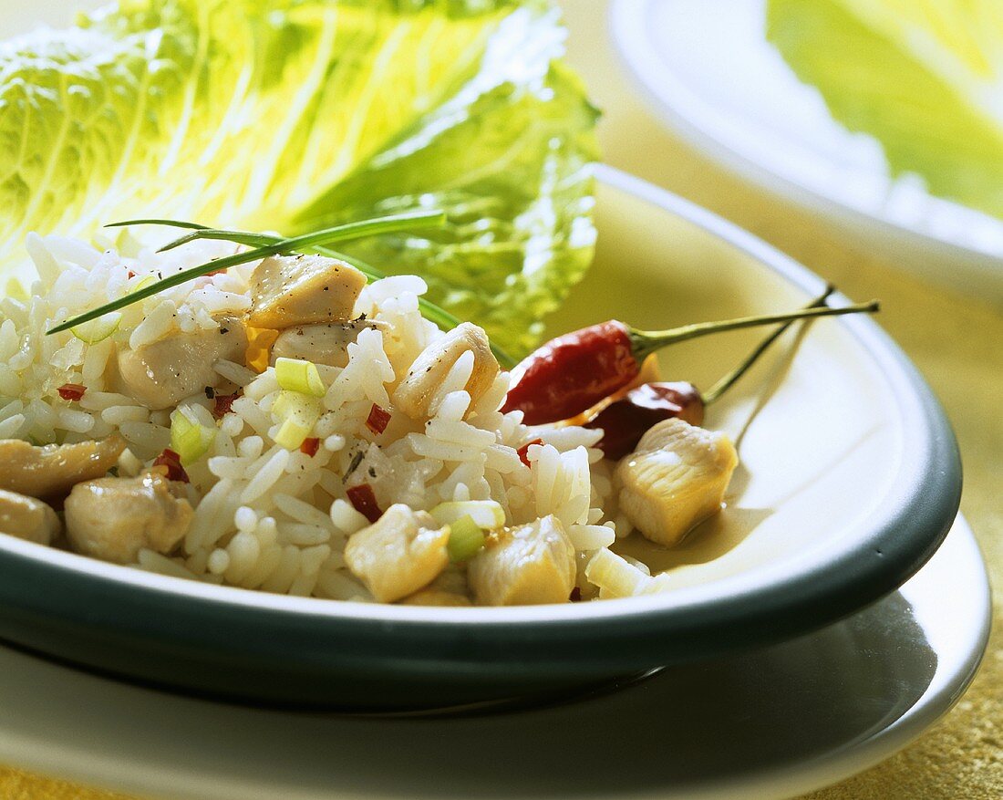 Rice salad with chicken and pieces of chili