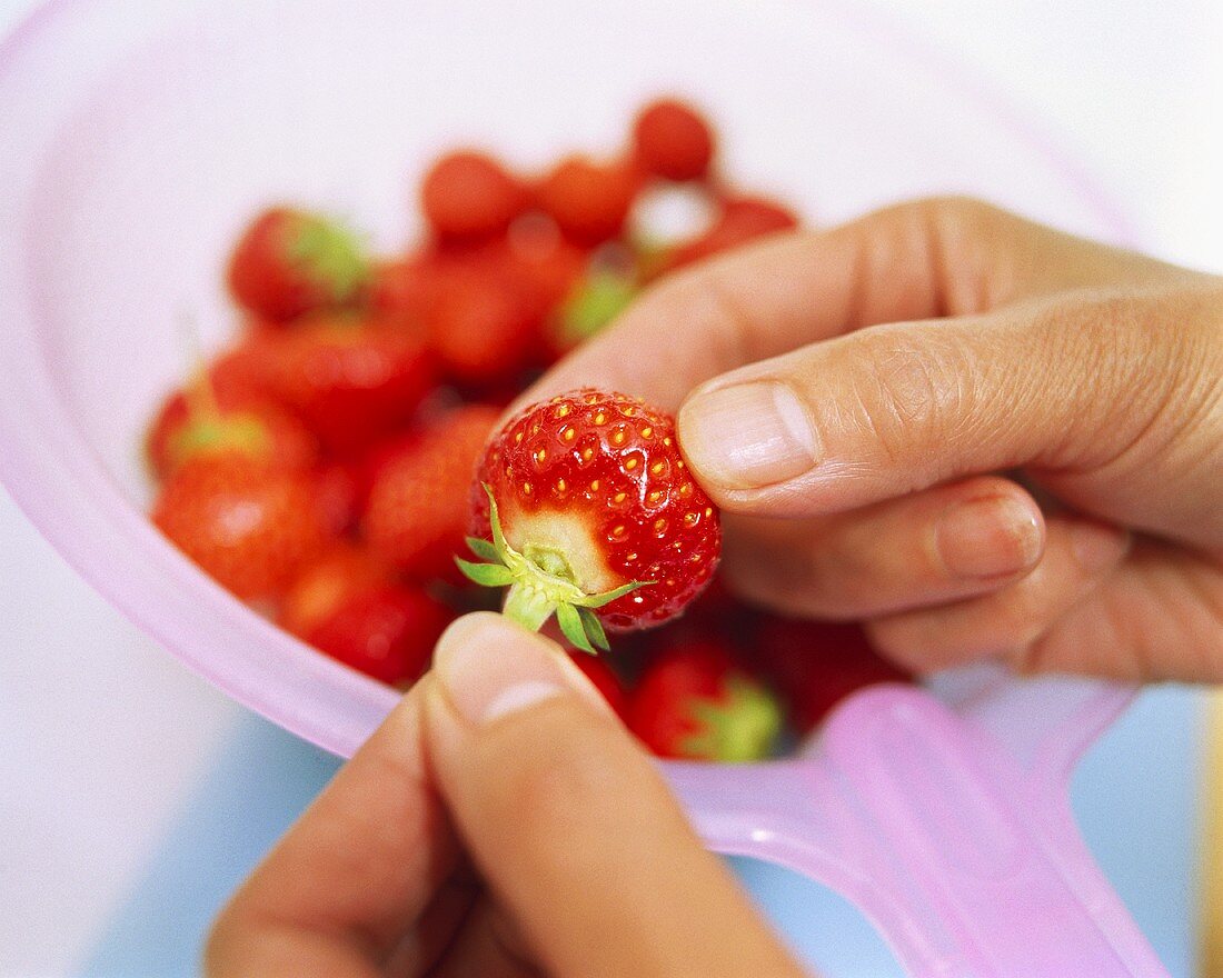 Hulling a strawberry