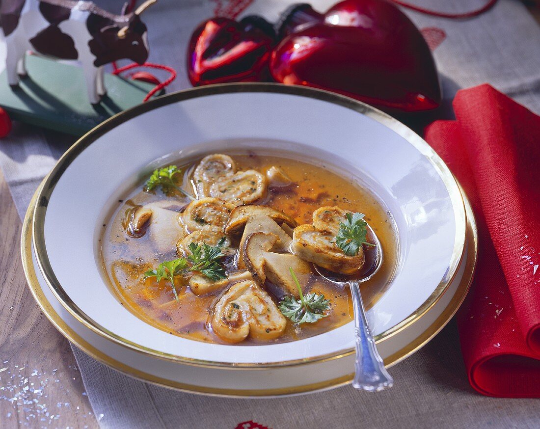 Cep bouillon with crepe rolls