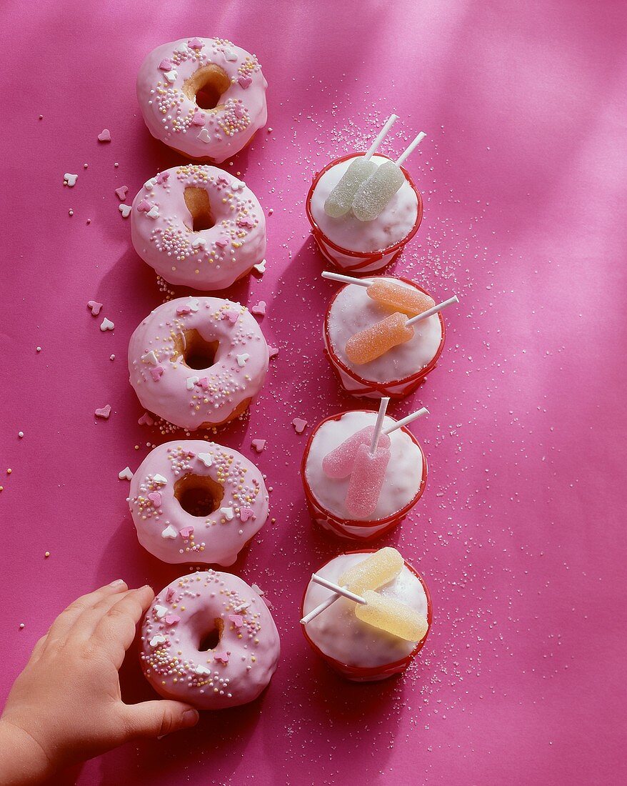 Nut muffins with icing & lollies & colourful mini-donuts