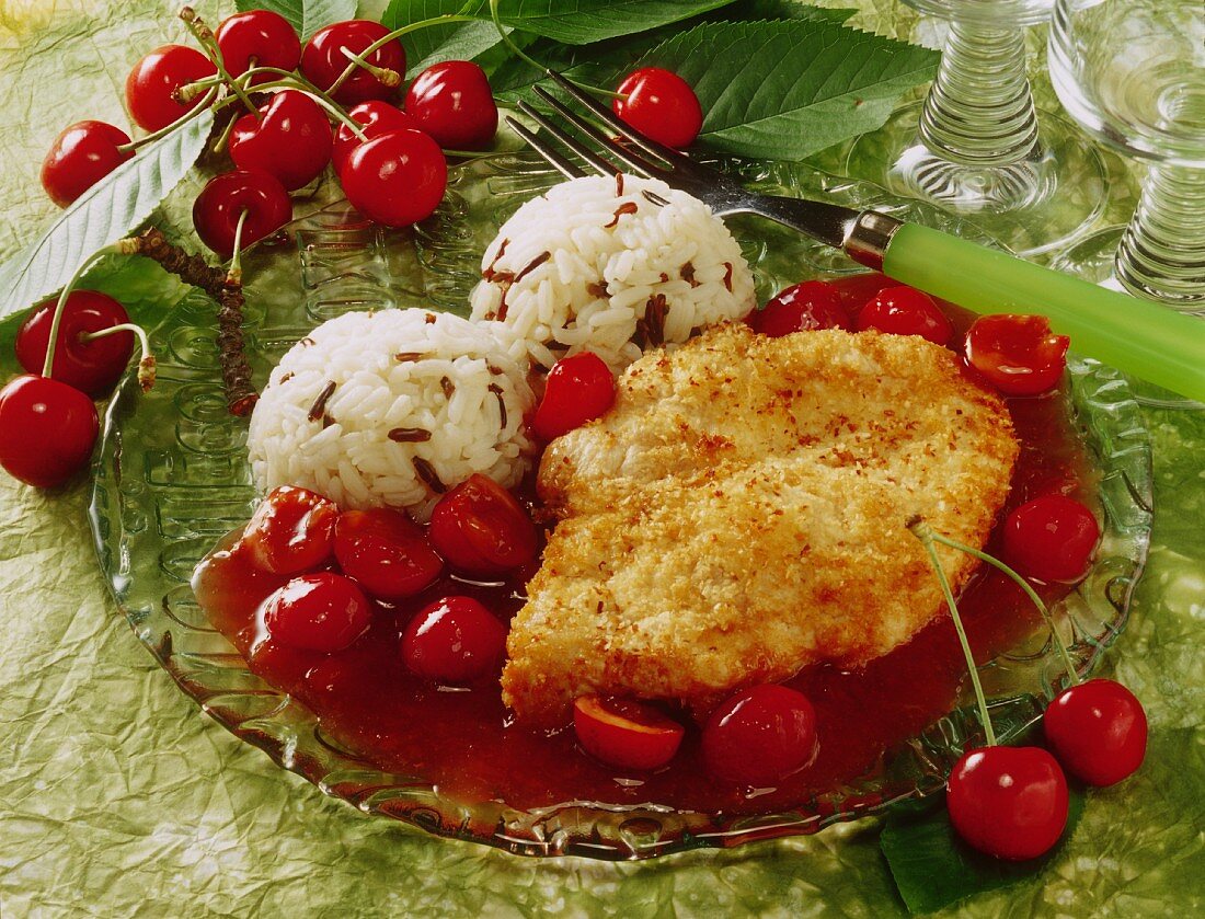 Chicken breast with coconut, cherry sauce and rice