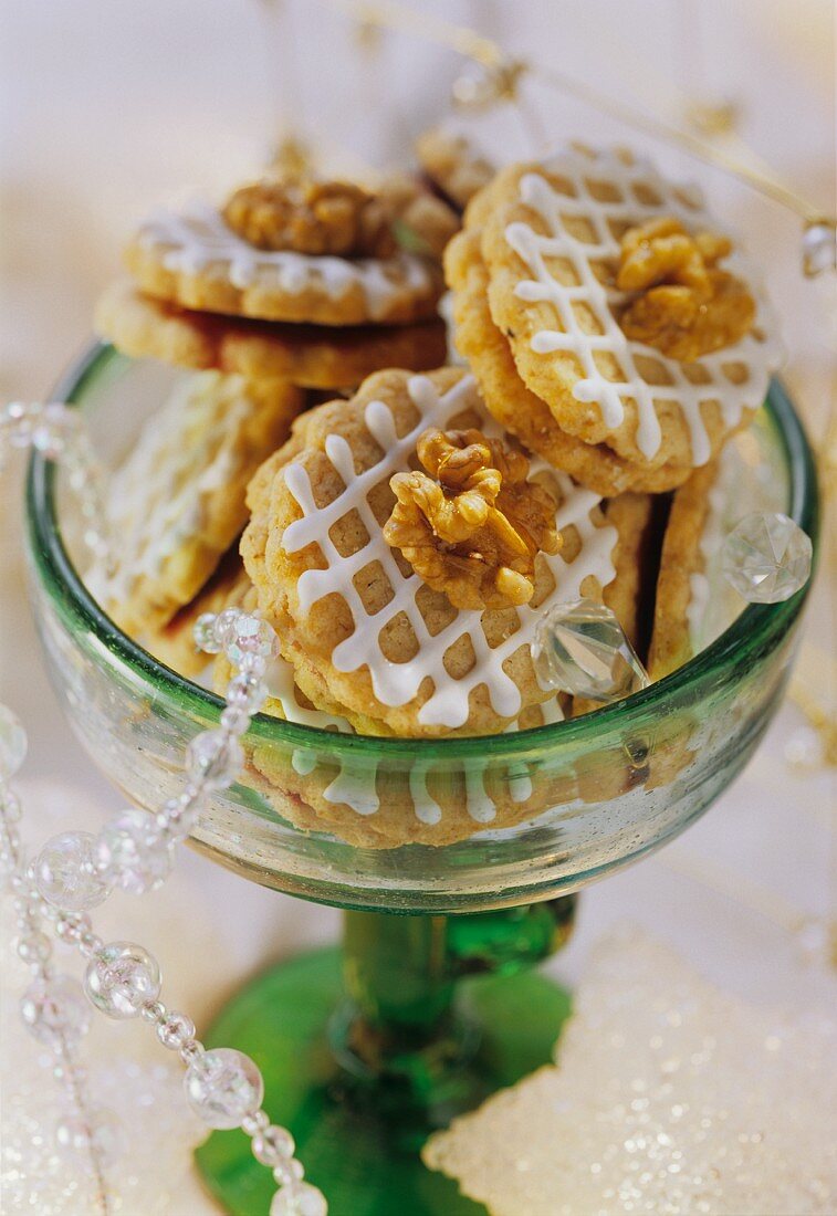 Decorated walnut biscuits with jam filling