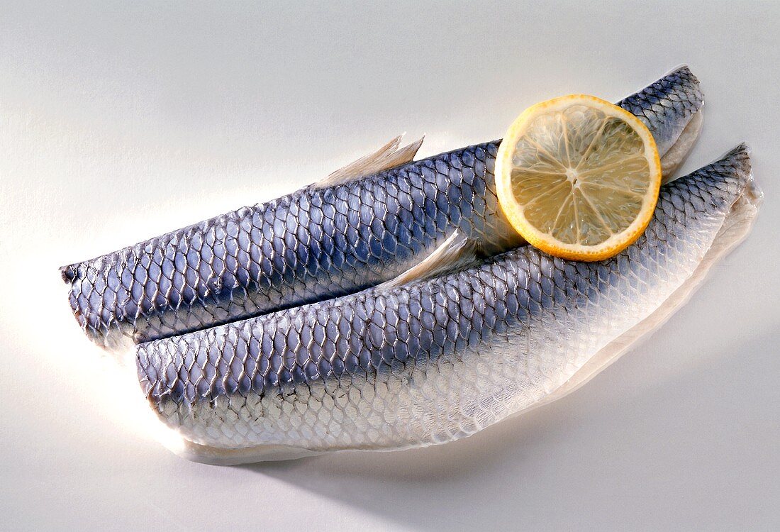 Two herrings with lemon slice