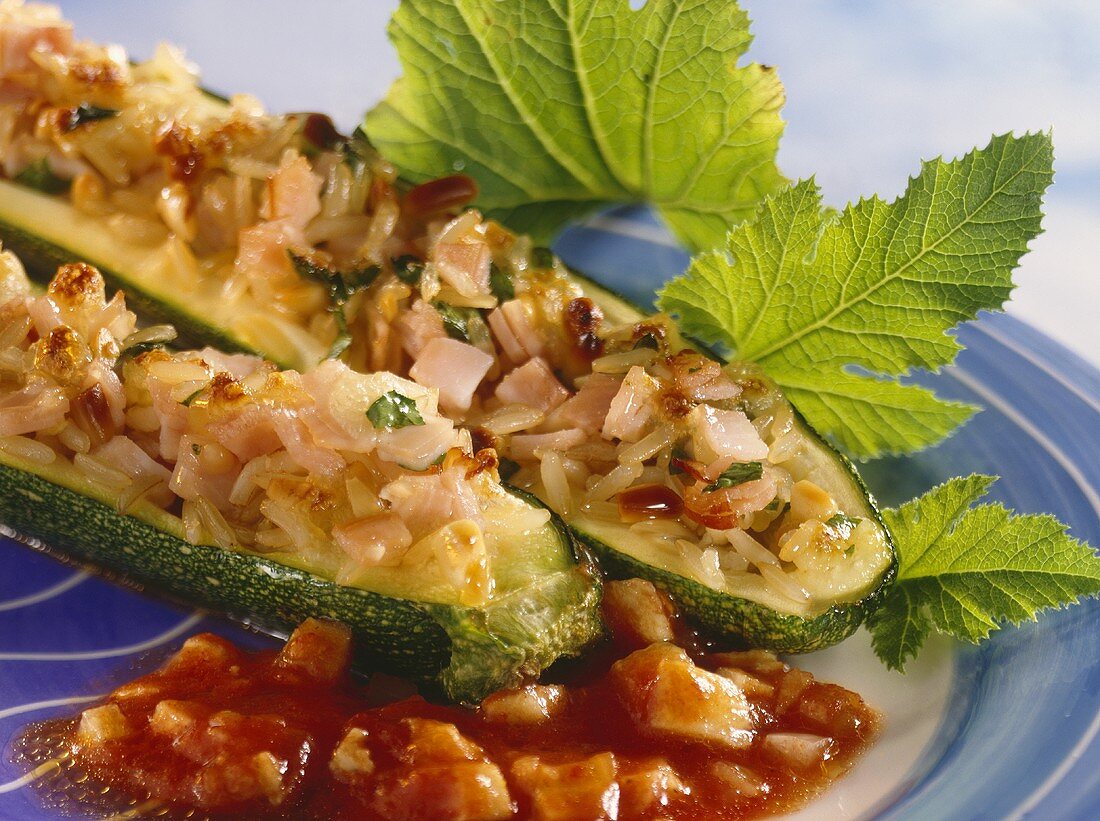 Courgettes with brown rice stuffing on tomato sauce