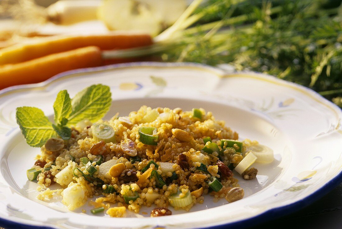 Tasty quinoa salad with fruit, raisins and mint