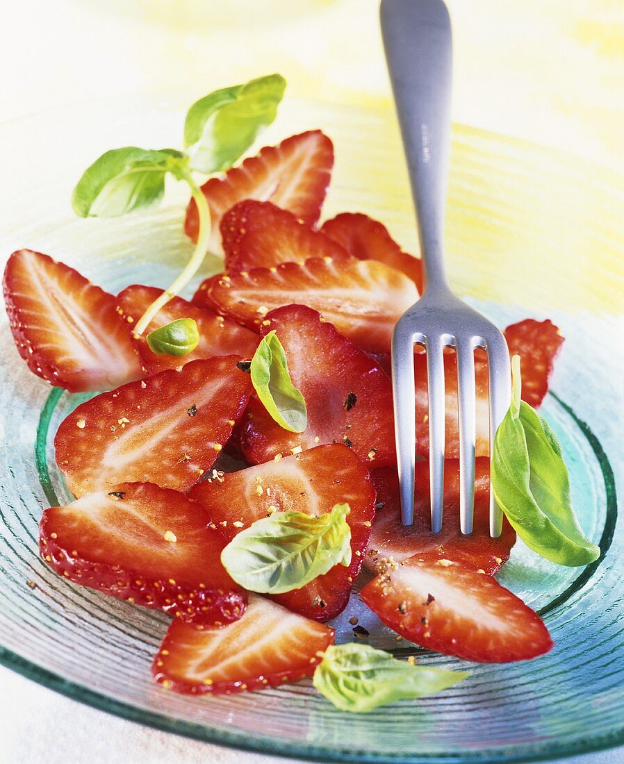 Strawberry carpaccio with black pepper and basil