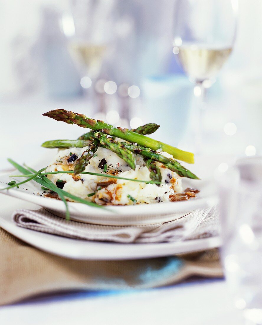 Roasted green asparagus on fish ragout