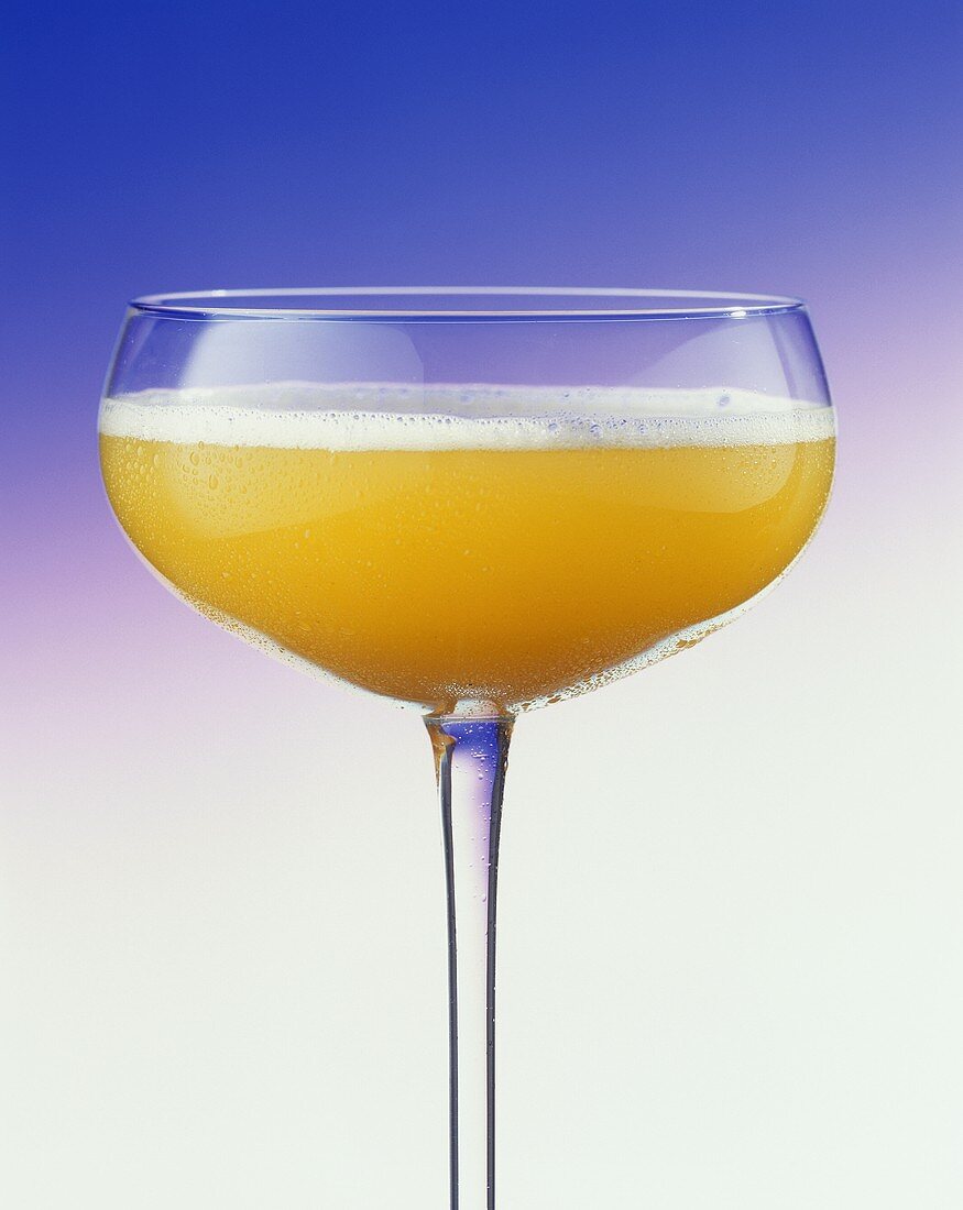 A glass of Bellini (champagne with peach puree)