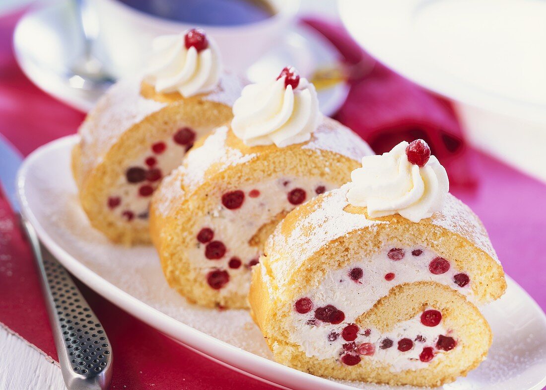 Sponge roulade filled with redcurrant mousse