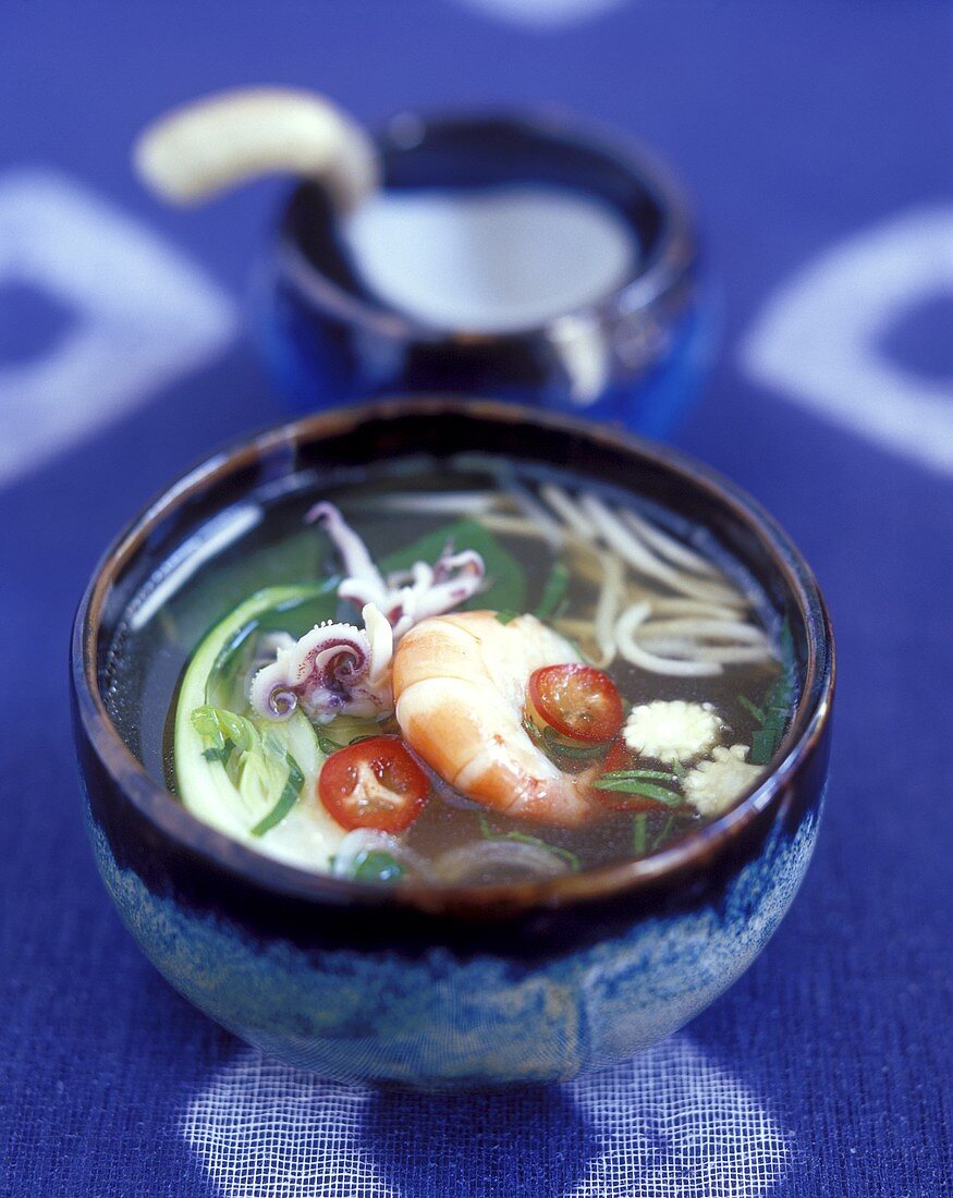 Asian soup with vegetables, noodles and seafood