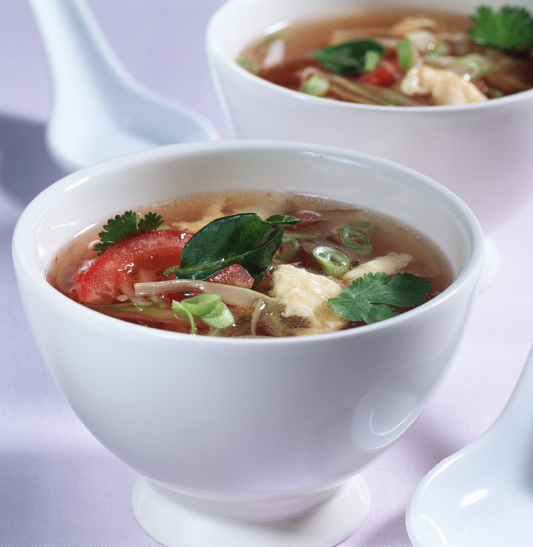 Asian tomato soup with egg and lime leaves