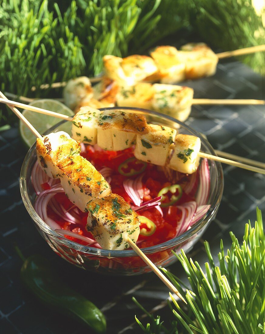 Barbecued cheese kebabs with tomato and onion salad