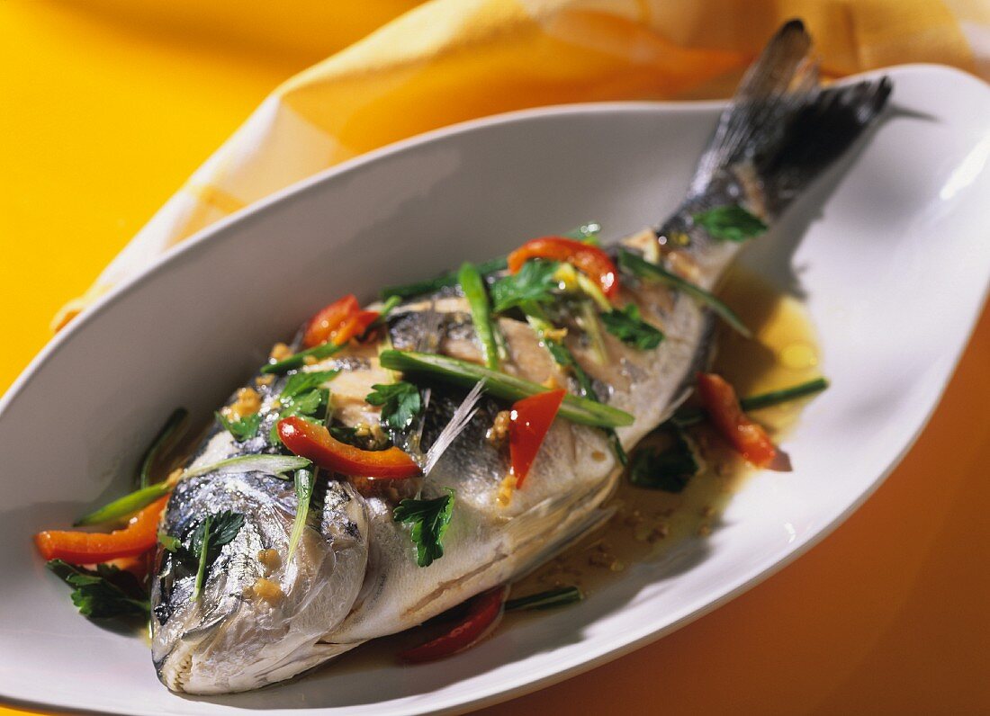 Steamed bream with ginger, pepper & spring onions
