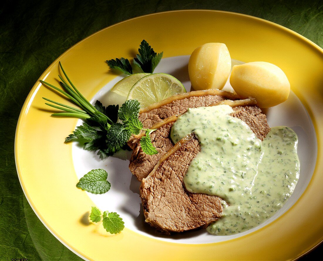 Boiled brisket with herb sauce and potatoes