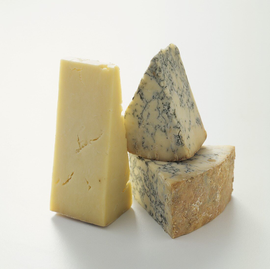 Two pieces of Stilton and one piece of Cheddar