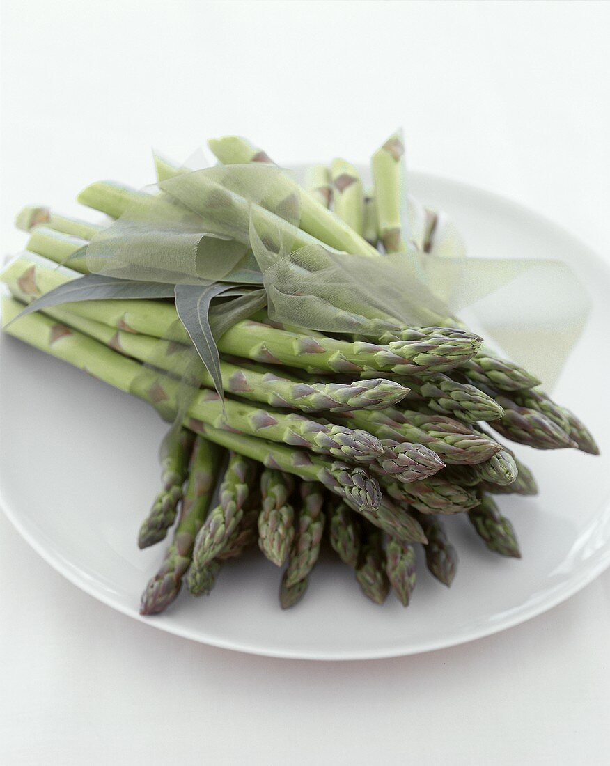 Fresh green asparagus on a plate