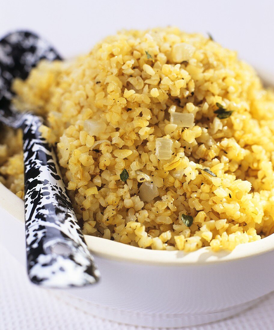 Cooked and spiced bulgur in bowl