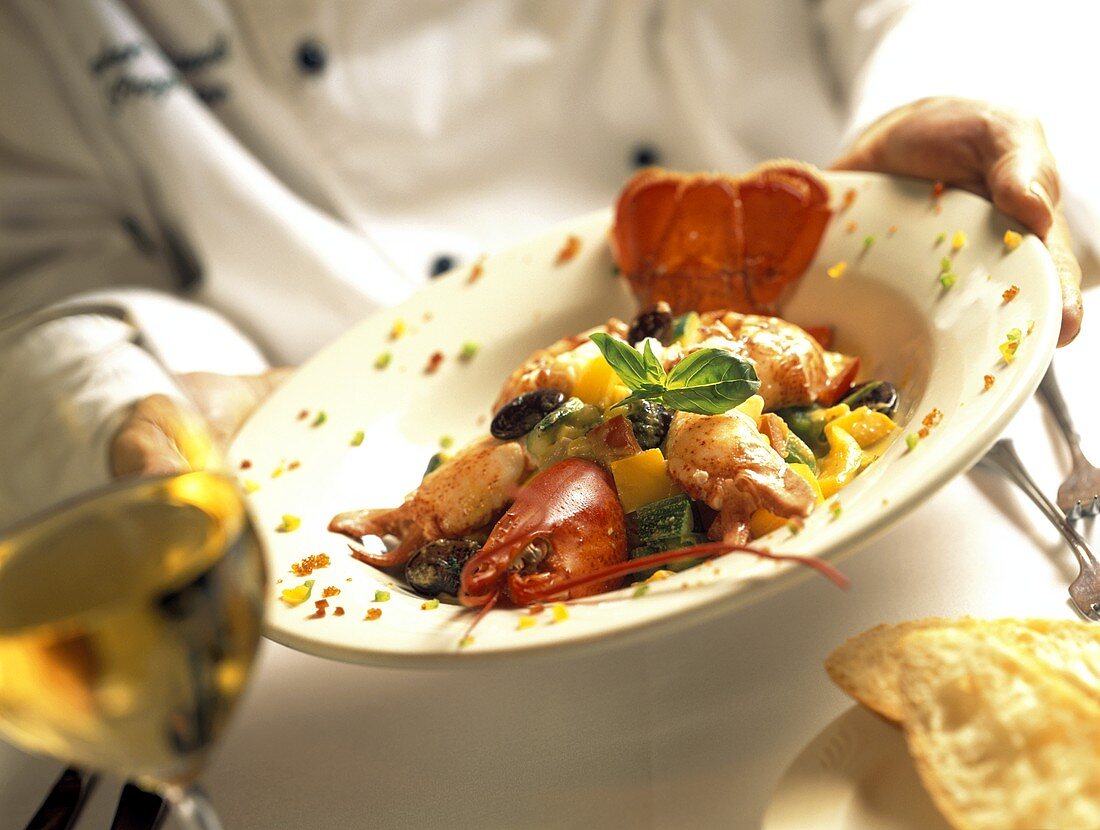 Waiter Serving Lobster Dish