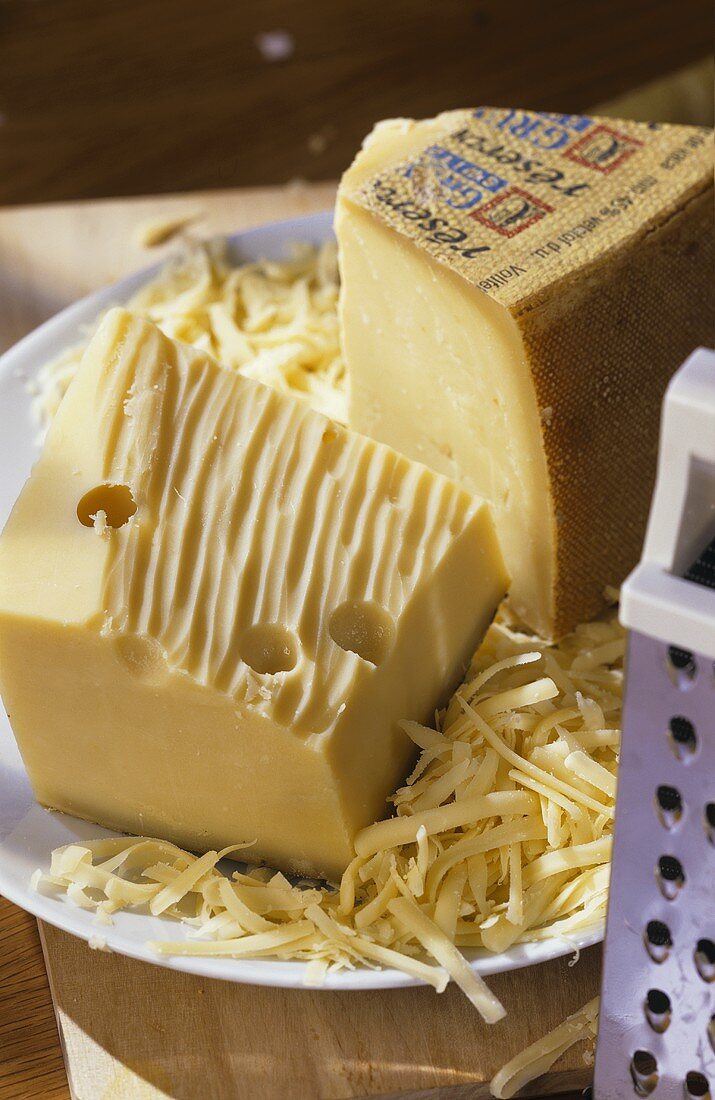 Emmental and Gruyere cheese, pieces and grated