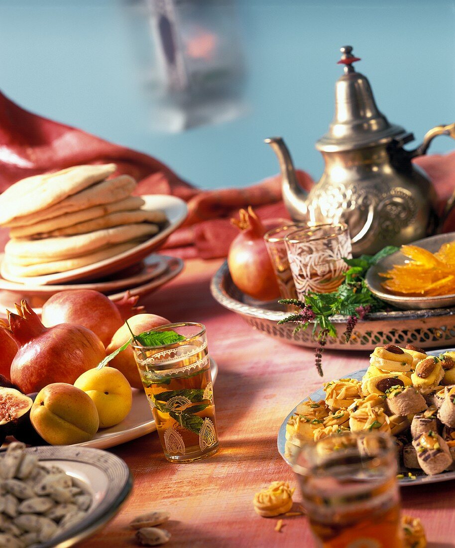 Moroccan buffet with pastries, fruit and tea