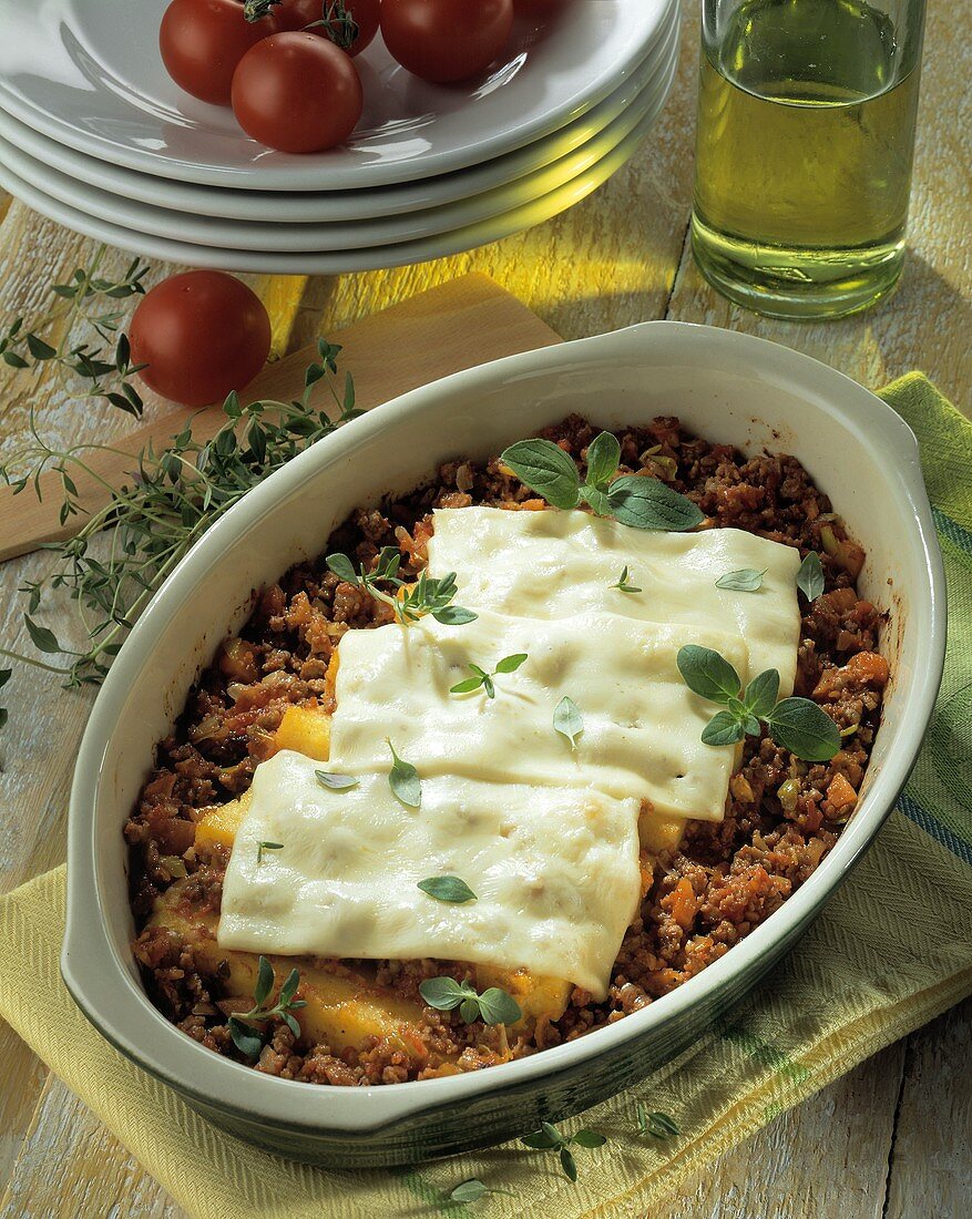 Polenta and mince bake topped with cheese slices