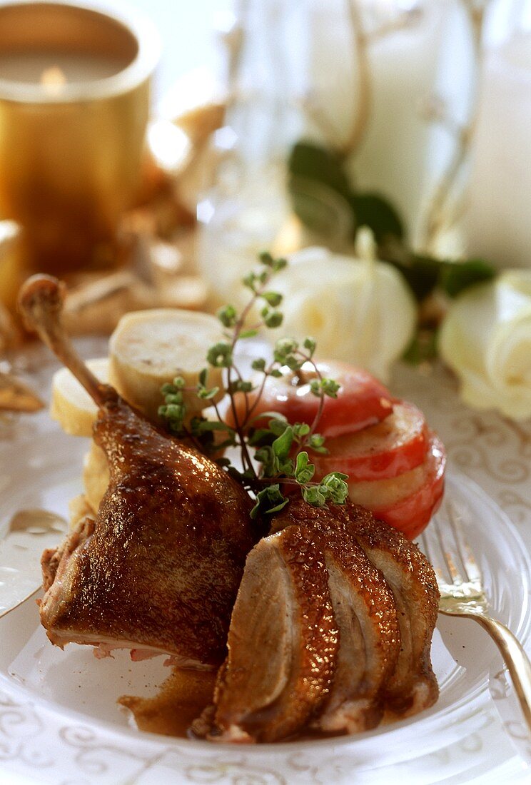 Duck leg, carved, with baked apples and dumplings