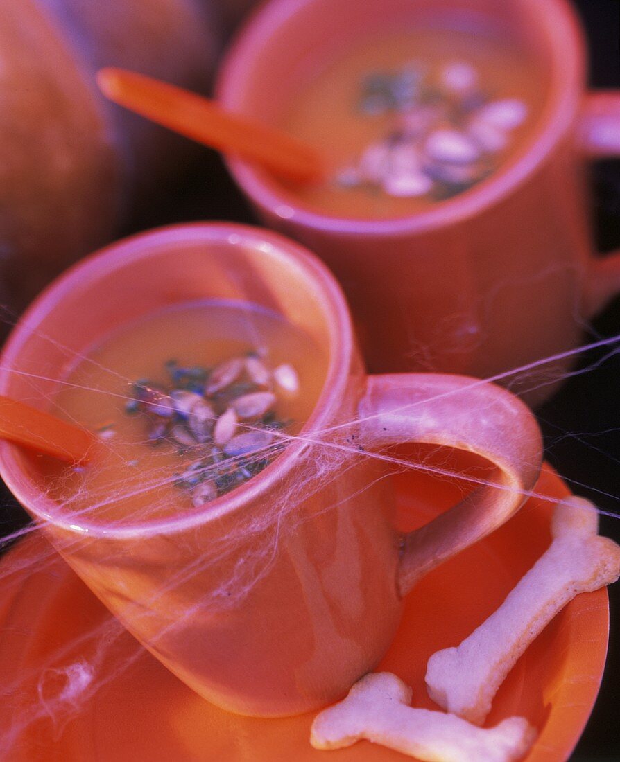 Pumpkin soup in cups for Halloween
