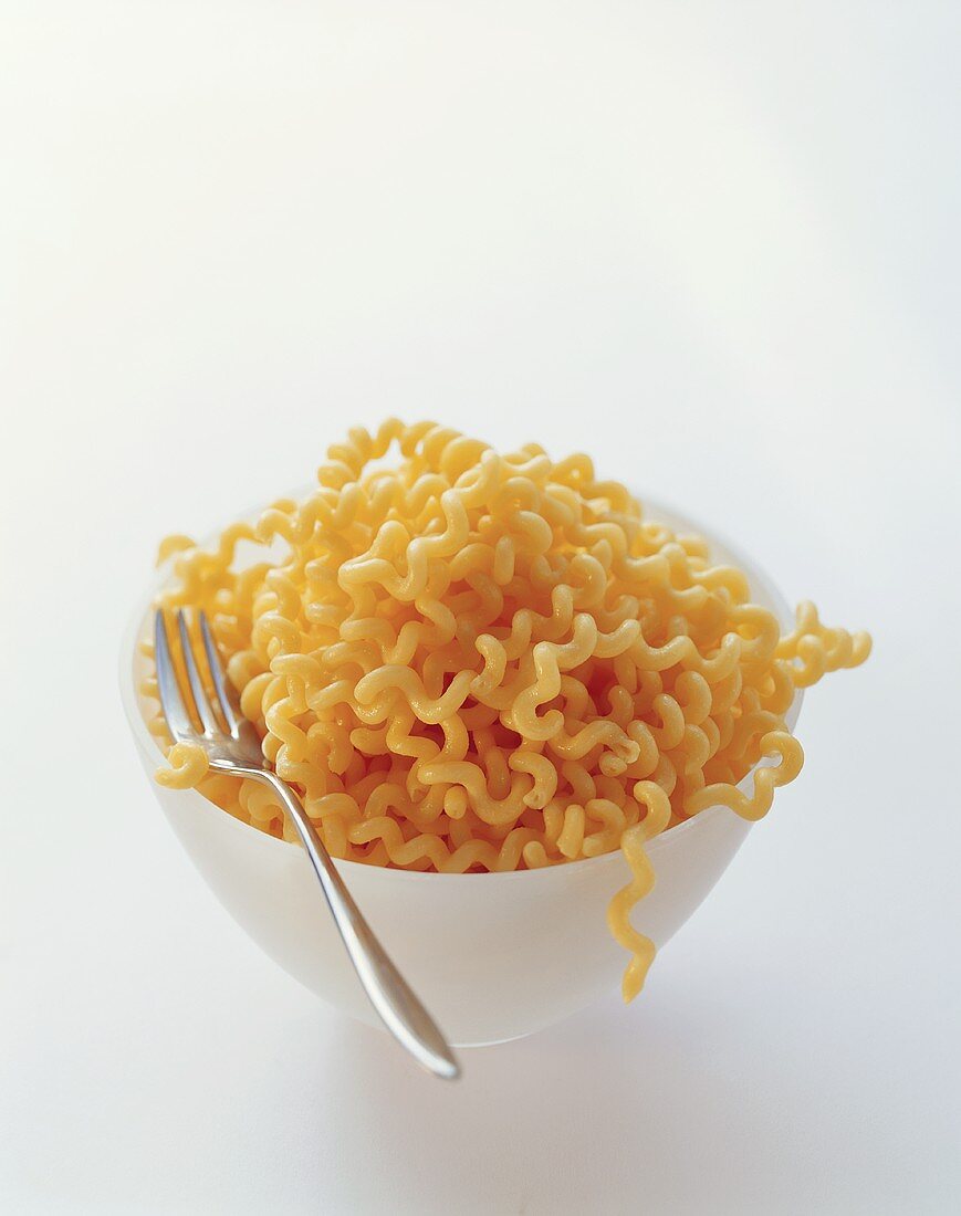 A bowl of fusilli with fork