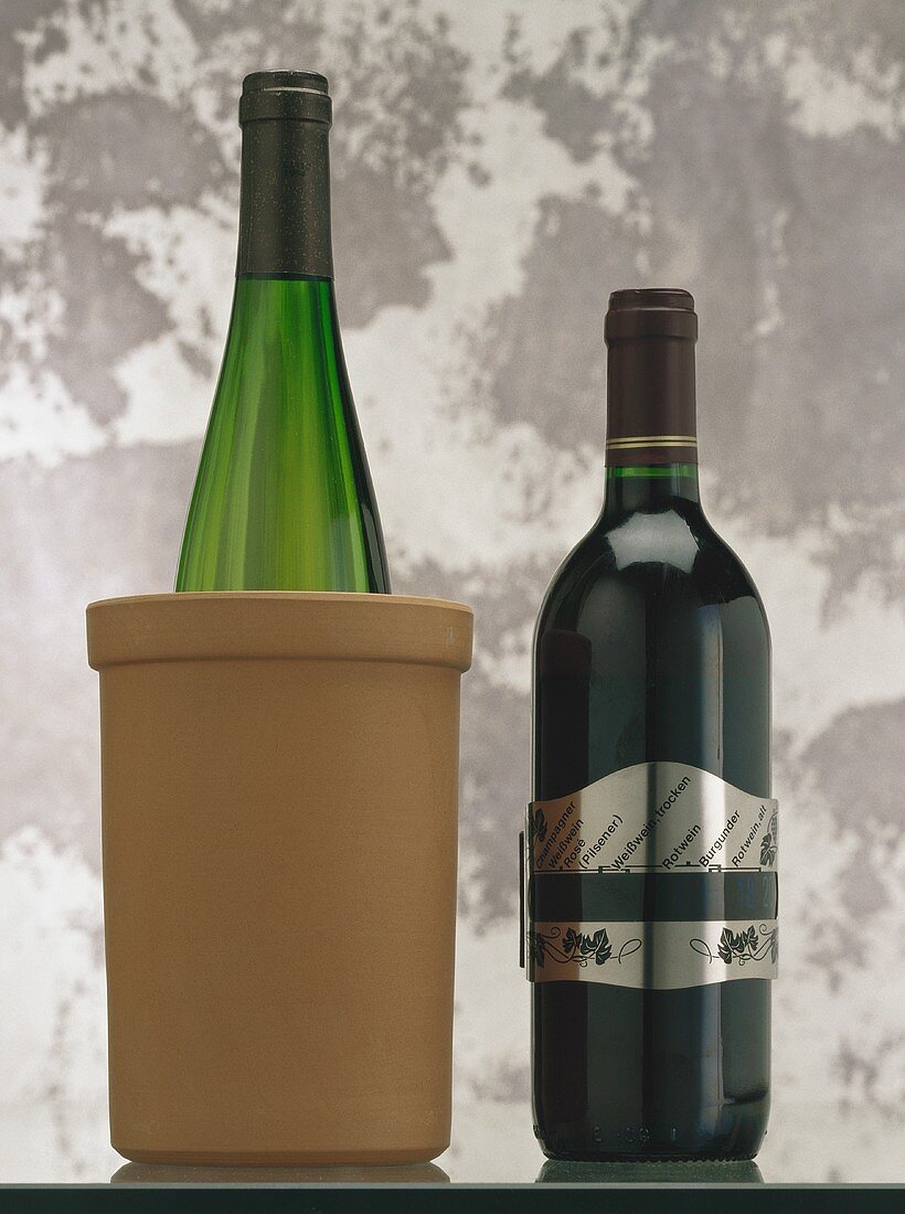 Wine bottles in clay cooler and with thermometer band