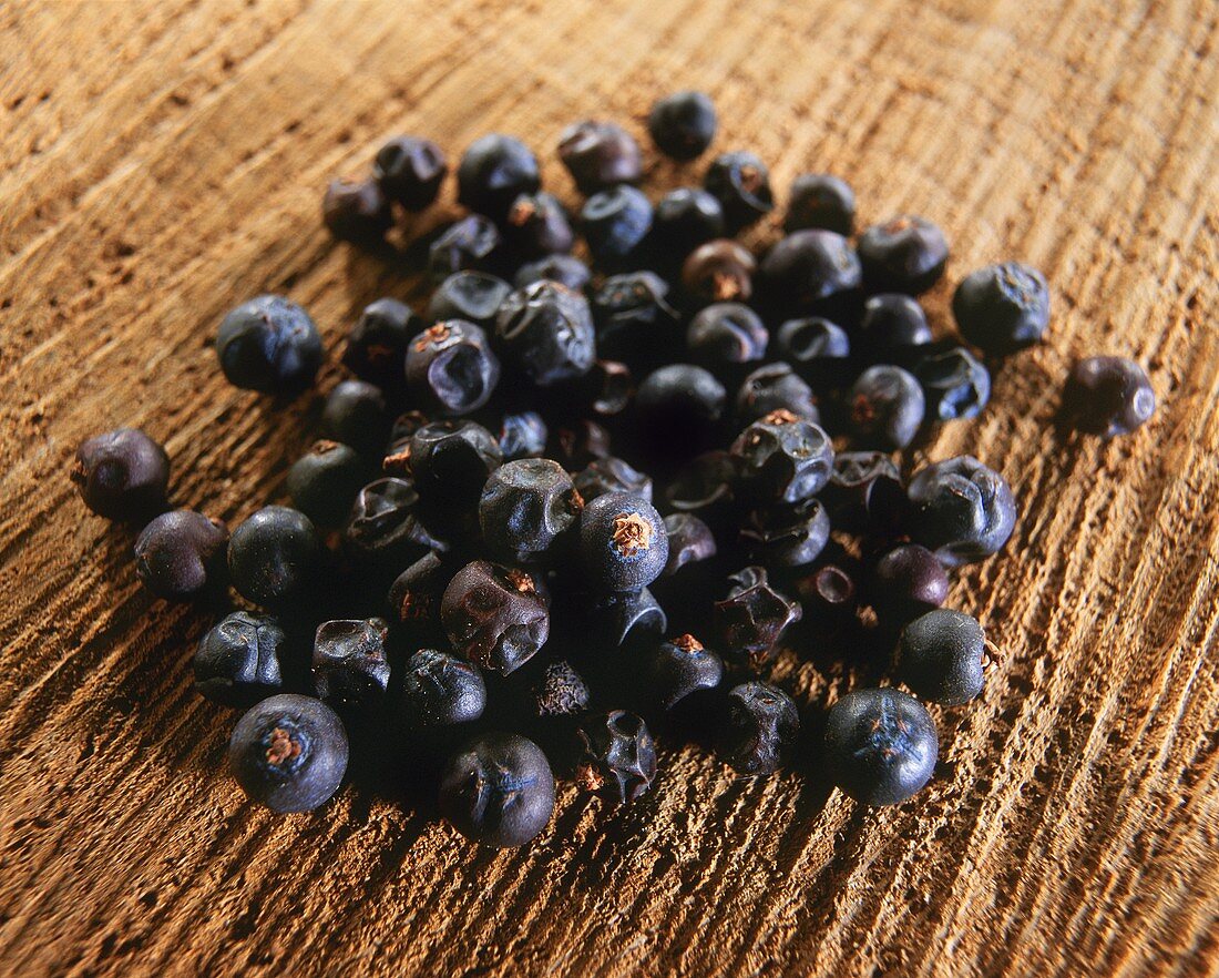 Juniper berries on a brown background