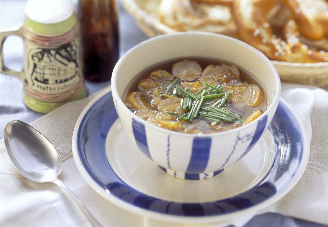 Pretzel soup with chives in soup bowl