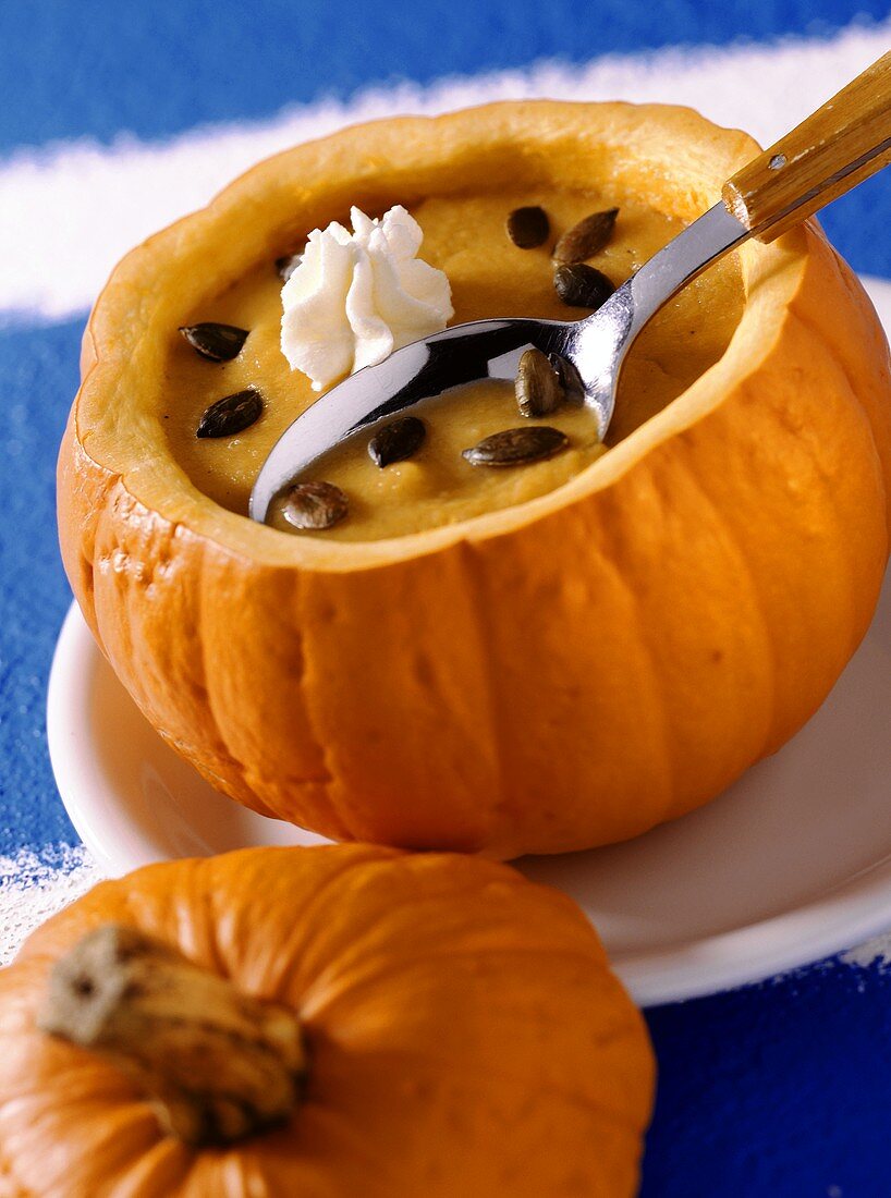 Honeyed pumpkin soup in hollowed-out pumpkin