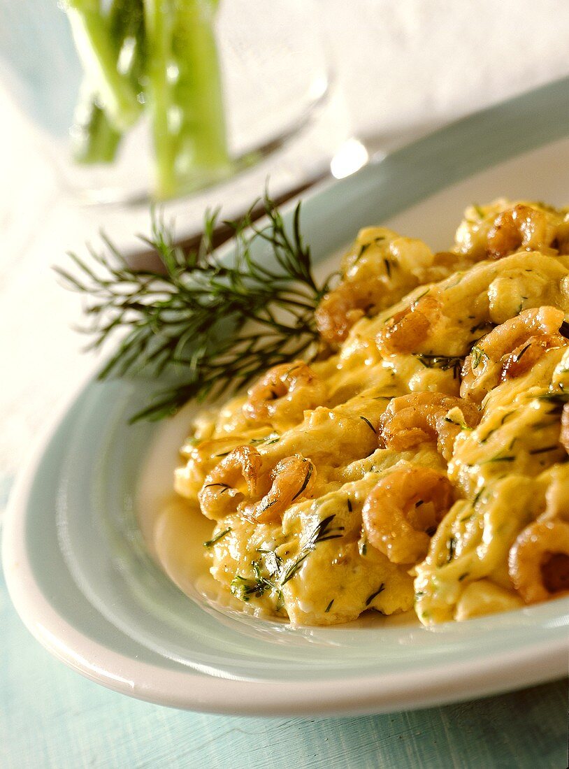 Scrambled egg with shrimps and dill