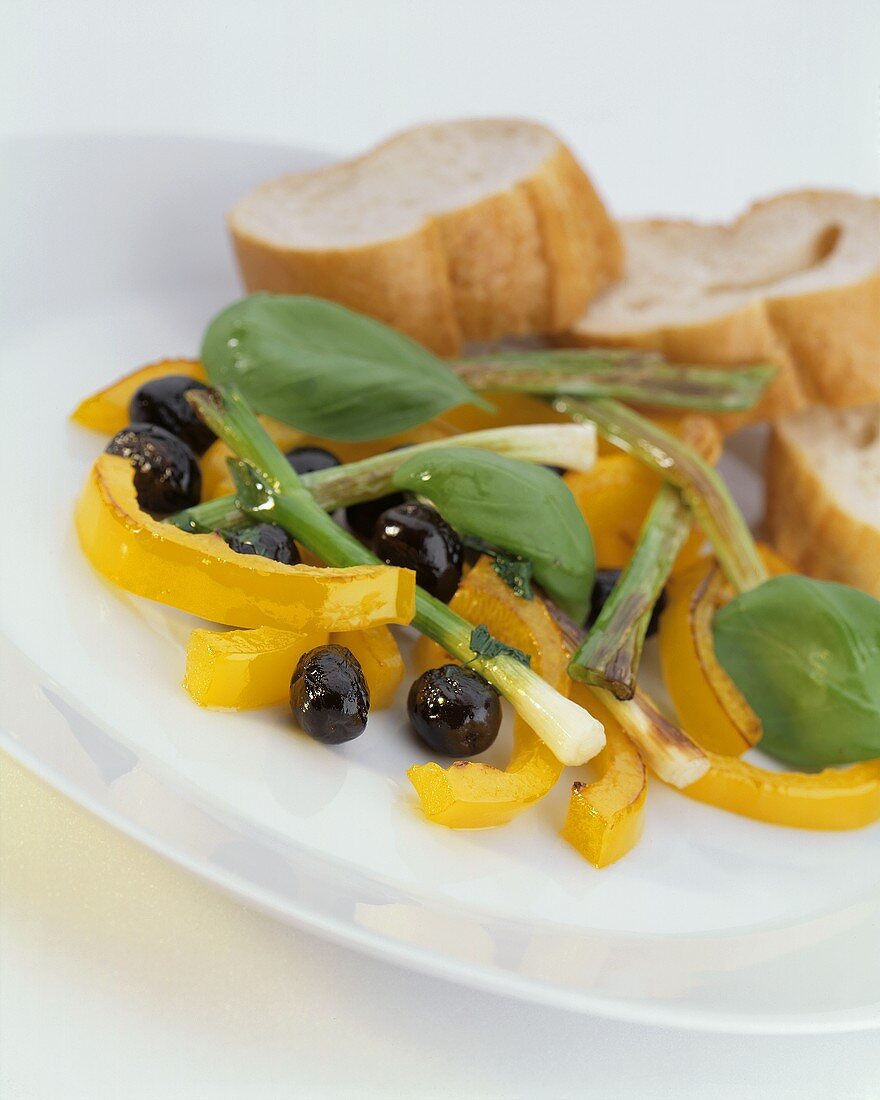 Warm pepper salad with olives an spring onions