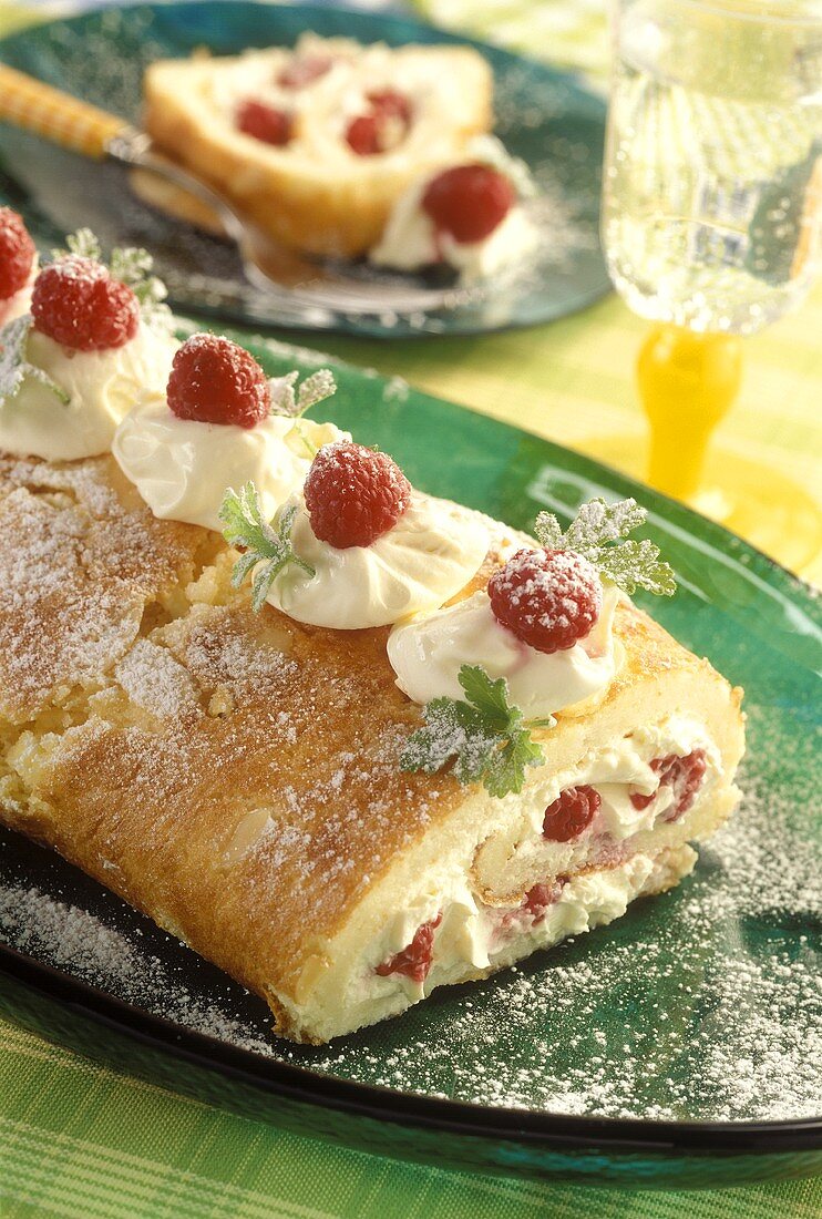 Sponge roll with raspberries and cream